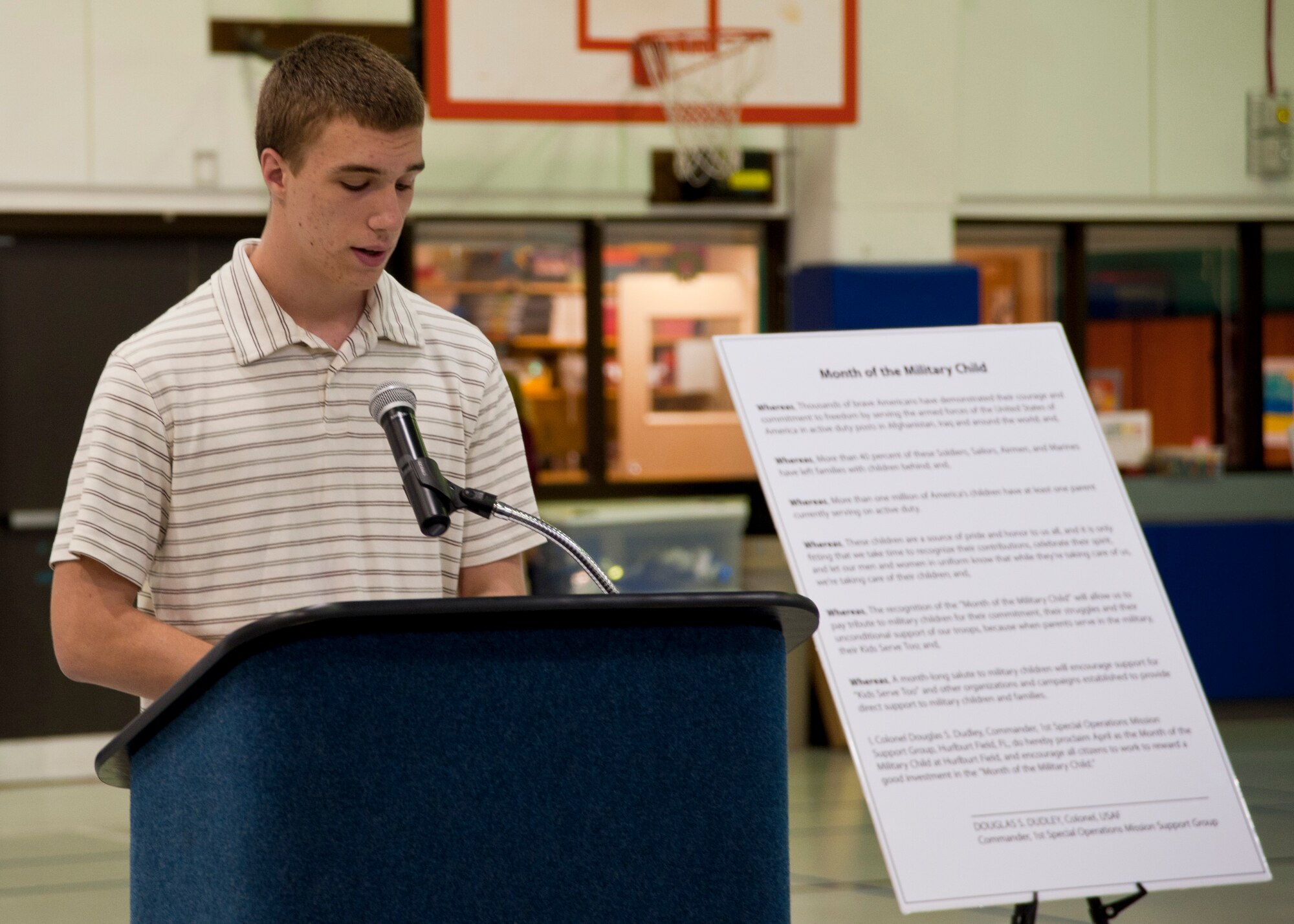 Ryan Tetla, son of Col. Robert Tetla, 460th Medical Group Commander and Lori Tetla, Headquarters Air Force Special Operations, chief of Financial Services, reads the proclamations for Month of the Military Child and Child Abuse Prevention Month at the Hurlburt Field Youth Center on Hurlburt Field, Fla., April 3, 2013. According to the National Child Traumatic Stress Network’s website, April was first declared Child Abuse Prevention Month by presidential proclamation in 1983 as a time to acknowledge the importance of families and communities working together to prevent child abuse. (U.S. Air Force photo by Senior Airman Krystal M. Garrett)  