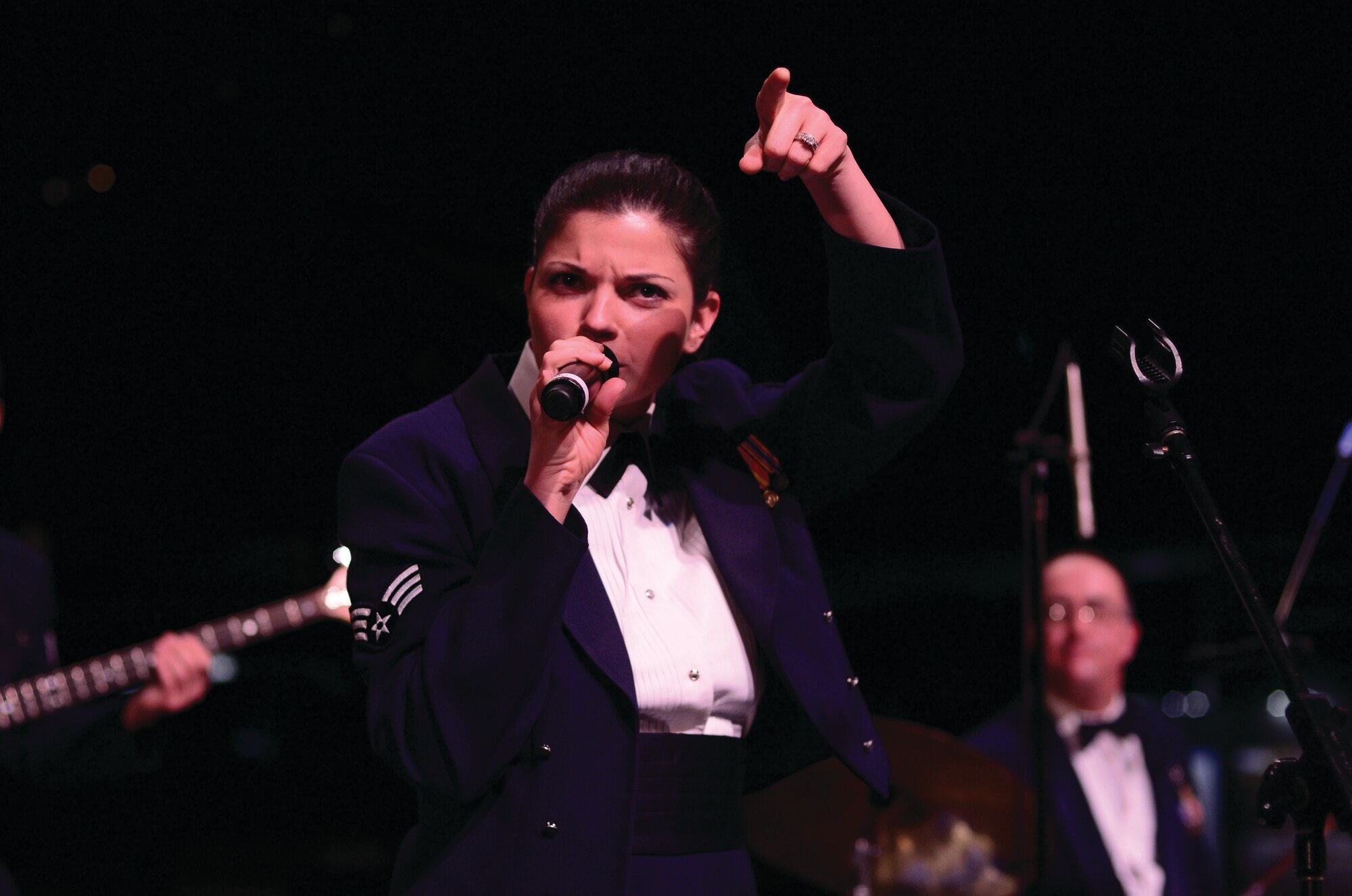 WRIGHT-PATTERSON AIR FORCE BASE, Ohio – Senior Airman Kelly Perry, vocalist for the Air Force Band of Flight’s “Systems Go,” performs during the dinner portion of the 445th Airlift Wing Annual Awards Banquet held at the National Museum of the U.S. Air Force March 9, 2013. (U.S. Air Force photo/Staff Sgt. Mikhail Berlin)