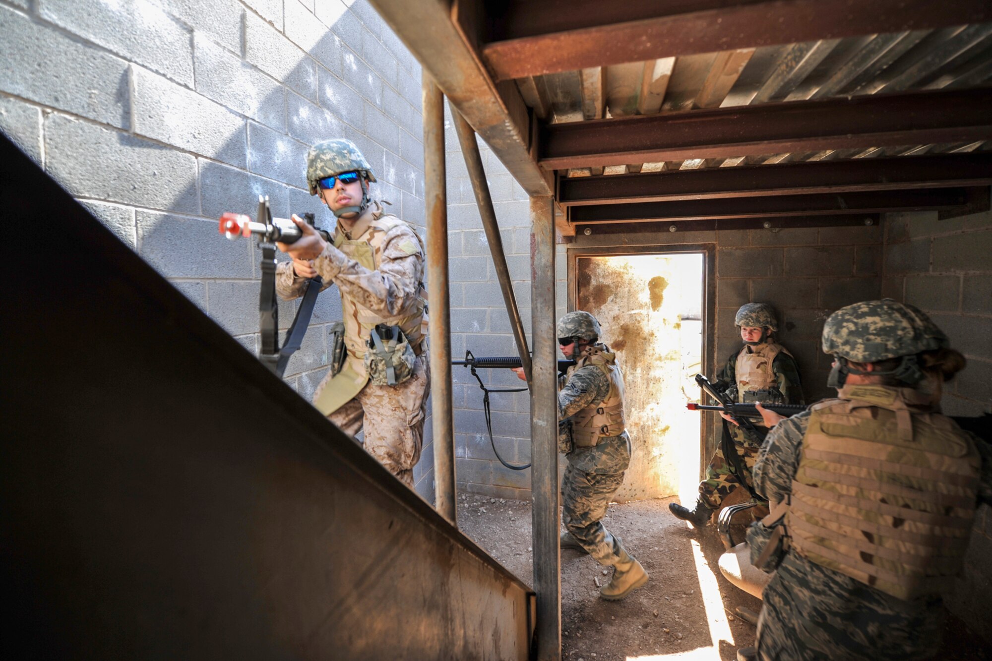 GOODFELLOW AIR FORCE BASE, Texas-- Angelo State University Air Force ROTC cadets clear a building during a field training exercise at Camp Sentinel April 6. The ASU cadets were taught how to properly breach and clear rooms as well as posting security. (U.S. Air Force photo/ Airman 1st Class Michael Smith)