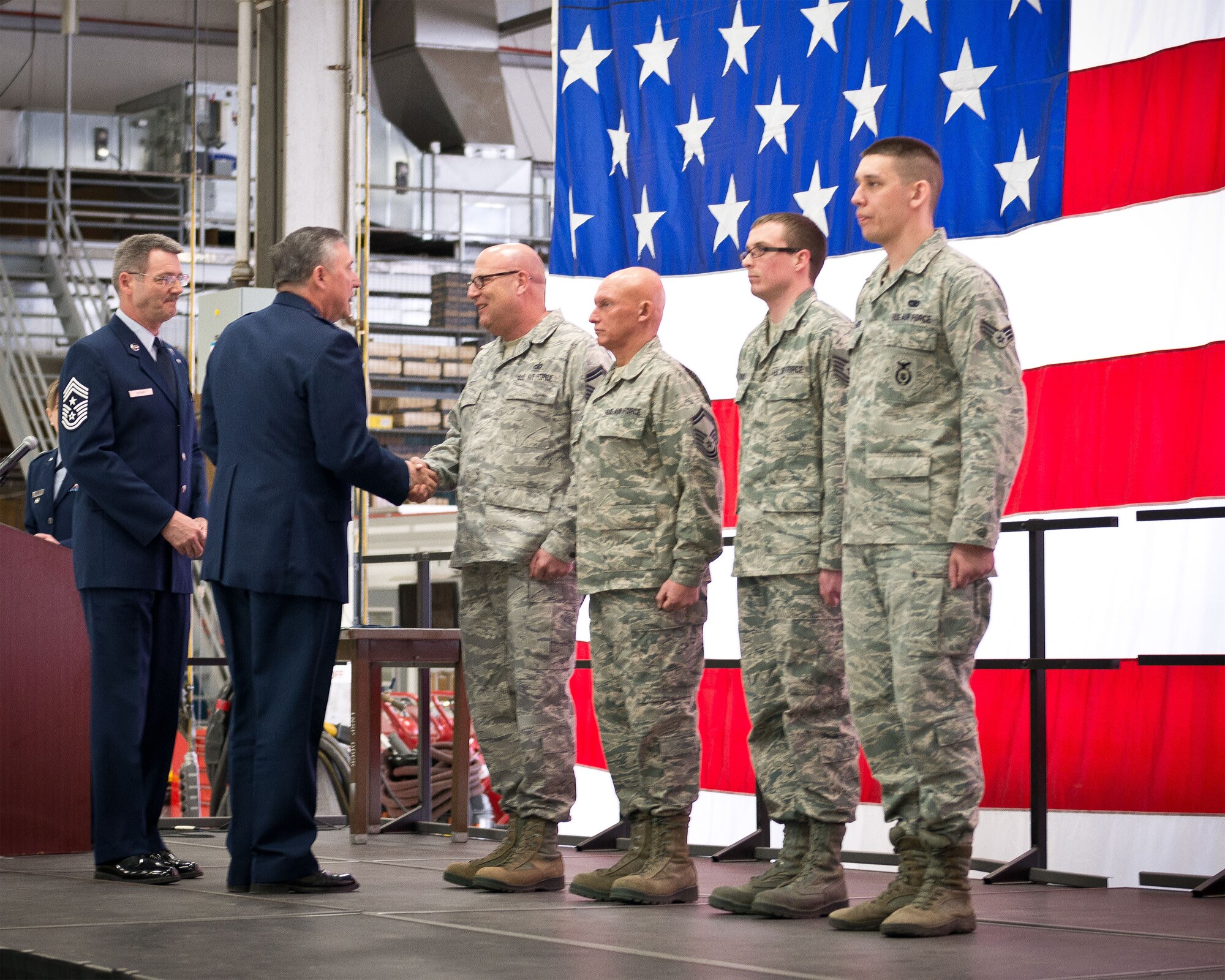 Col. Darrell Young, 934th Airlift Wing commander, and Command Chief Master Sgt. Mark Koenig, 934 AW command chief, recognize the 2012 Airmen of the Year, (left to right) Senior Master Sgt. Donald Scott, Senior Master Sgt. Peter Desanctis, Tech. Sgt. David Krause, Senior Airman Jacob Rylander, and Capt. Patrick McDonald (not pictured) during the quarterly commander's call at the Minneapolis-St. Paul Air Reserve Station, Minn.  (U.S. Air Force photo/Staff Sgt. Samantha Wagner)