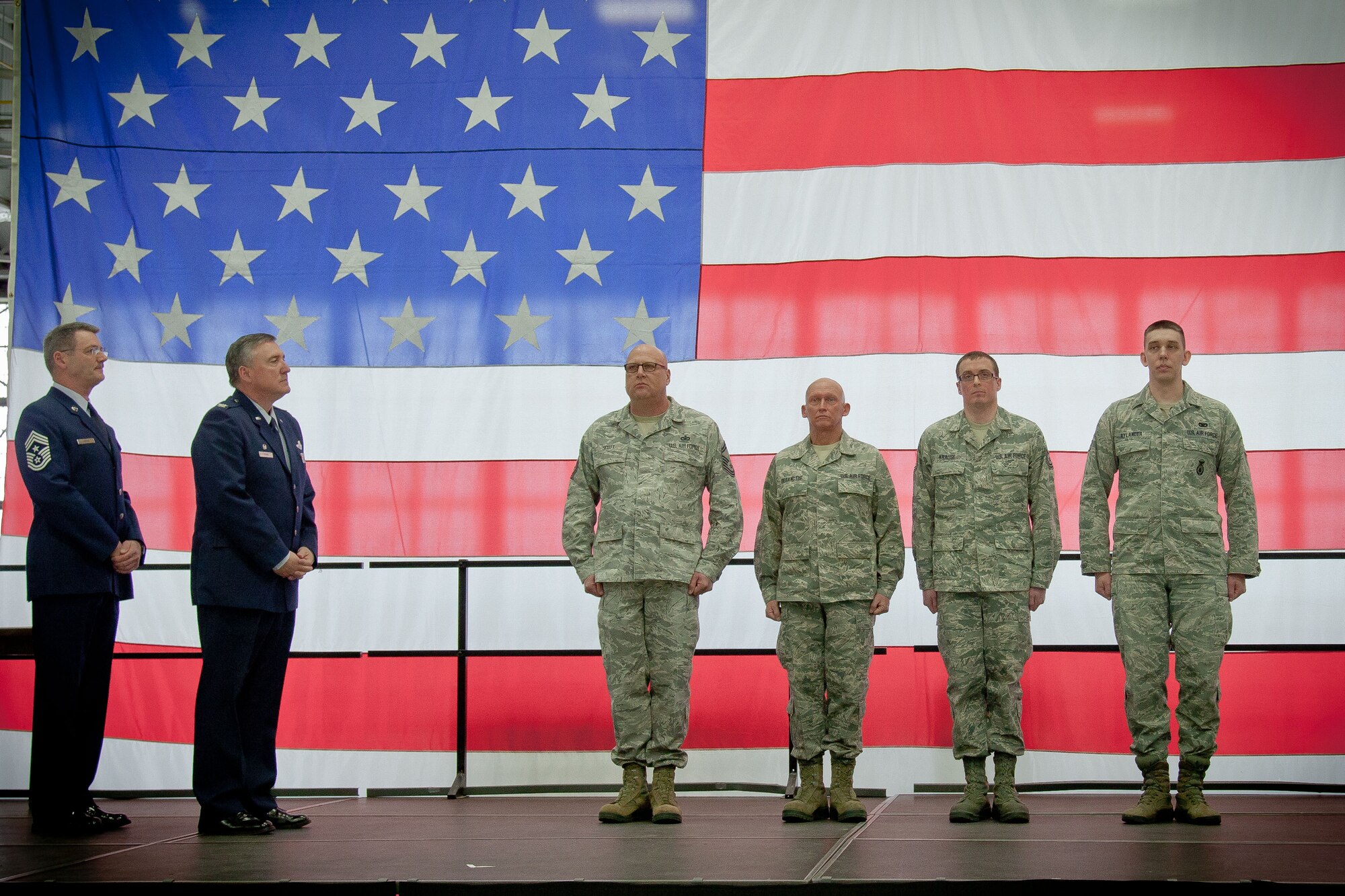Col. Darrell Young, 934th Airlift Wing commander, and Command Chief Master Sgt. Mark Koenig, 934 AW command chief, recognize the 2012 Airmen of the Year, (left to right) Senior Master Sgt. Donald Scott, Senior Master Sgt. Peter Desanctis, Tech. Sgt. David Krause, Senior Airman Jacob Rylander, and Capt. Patrick McDonald (not pictured) during the quarterly commander's call at the Minneapolis-St. Paul Air Reserve Station, Minn.  (U.S. Air Force photo/Shannon McKay)