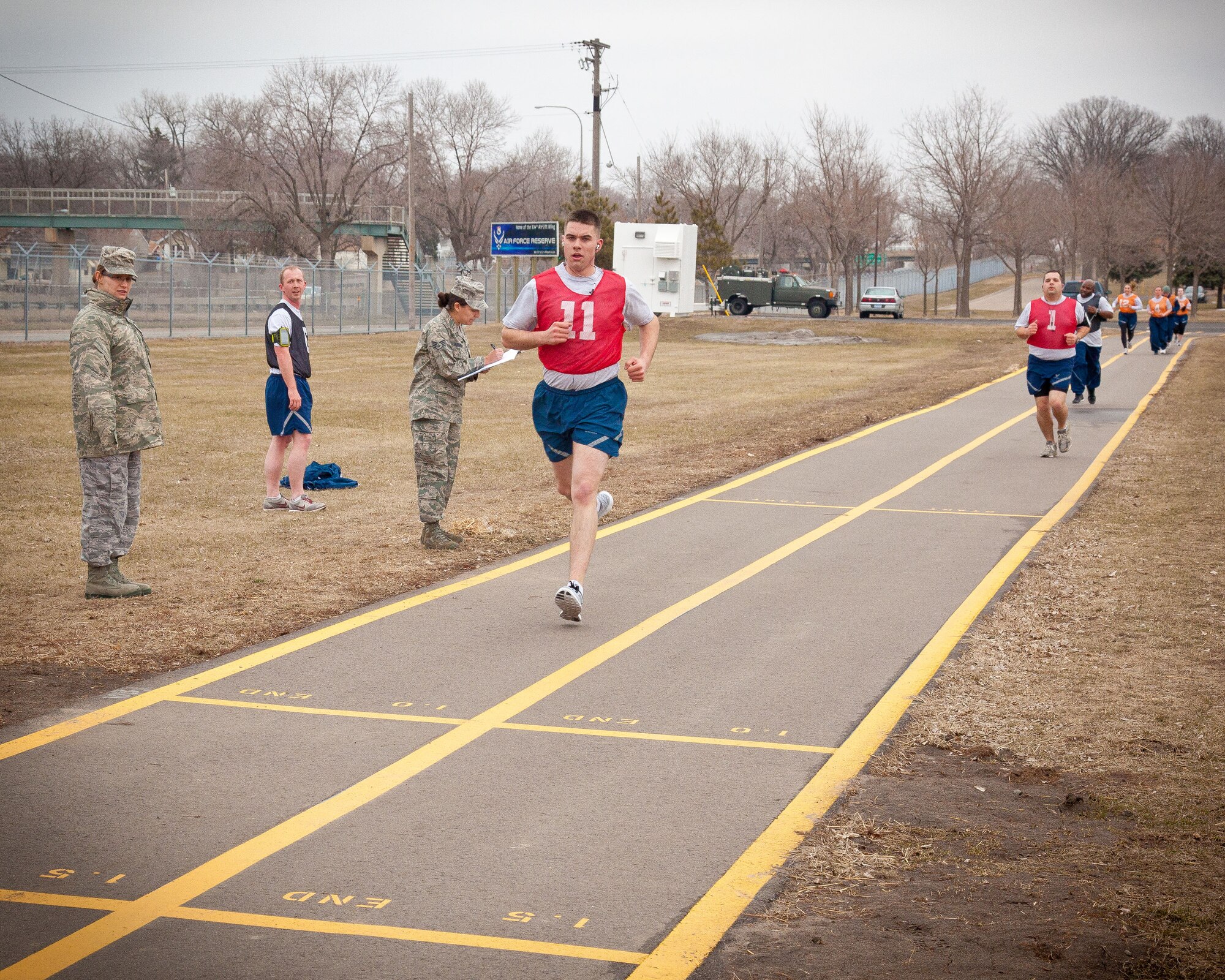 Airman Josh Kutzler, 934th Aircraft Maintenance Squadron, approaches the finish line for his run.  Airmen from the 934th Airlift Wing complete the running portion of their annual physical fitness assessment during the April Unit Training Assembly weekend at the Minneapolis-St. Paul Air Reserve Station, Minn.  (U.S. Air Force photo/Shannon McKay)