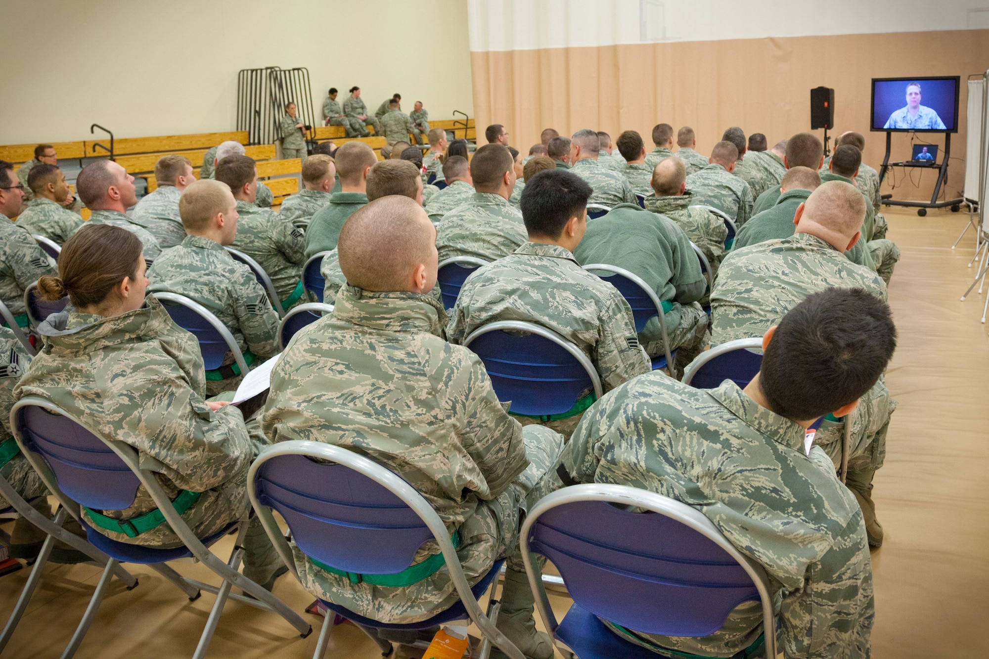 Airmen from the 934th Airlift Wing watch a briefing video as part of a Personnel Deployment Function exercise in preparation for the Operational Readiness Exercise in June at the Minneapolis-St. Paul Air Reserve Station, Minn.  (U.S. Air Force photo/Shannon McKay)