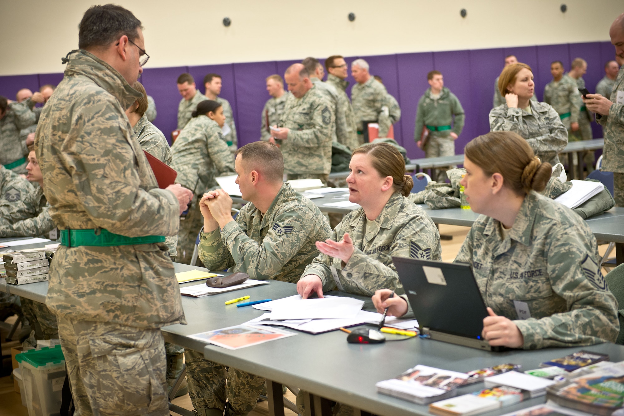 Tech. Sgt. Amanda Killebrew, 934th Aeromedical Staging Squadron, goes over an Airman's medical requirements for deployment.  Airmen from the 934th Airlift Wing participated in a Personnel Deployment Function exercise in anticipation of the Operational Readiness Exercise in June at the Minneapolis-St. Paul Air Reserve Station, Minn.  (U.S. Air Force photo/Staff Sgt. Samantha Wagner)