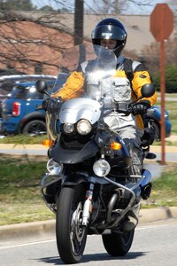 An Airman assigned to the 497th Intelligence, Surveillance and Reconnaissance Squadron participates in a group motorcycle ride during the second annual Sentinel Motorcycle Safety Show hosted by the 497th ISR Group at Langley Air Force Base, Va., April 3, 2013. There were two trophies awarded during the show based on a voting system of the crowd’s favorite in two separate categories: cruiser class and sport class. (U.S. Air Force photo by Staff Sgt. Jeff Nevison/Released)