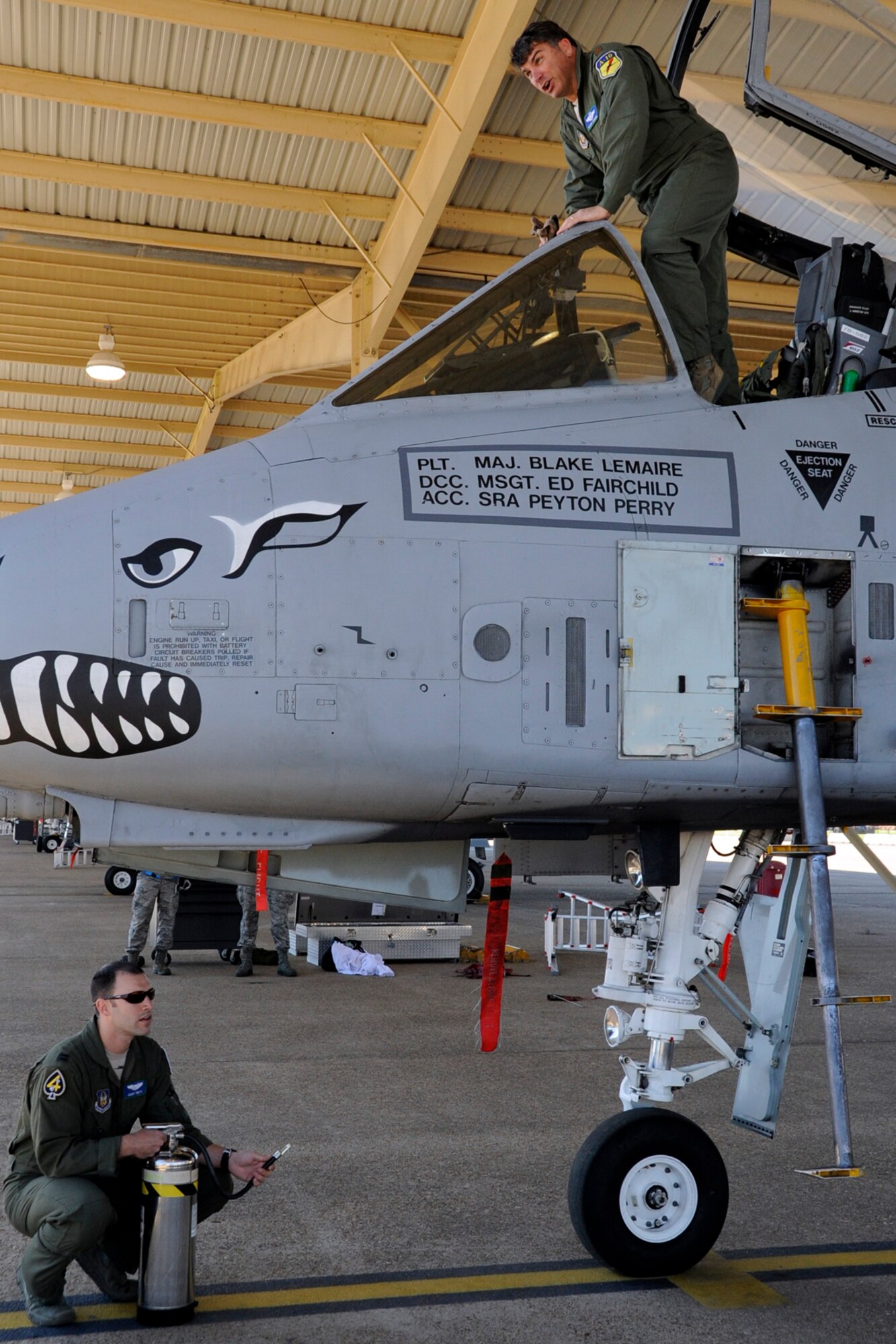 Maj. Blake Lemaire prepares to step into an ambush after his last sortie in an A-10 Thunderbolt II at Barksdale Air Force Base, La., April 5, 2013. Lemaire participated in a four-ship sortie for his last mission from Barksdale with three other pilots assigned to the 47th Fighter Squadron, who were also making their final flights. (U.S. Air Force photo by Master Sgt. Jeff Walston/Released)    