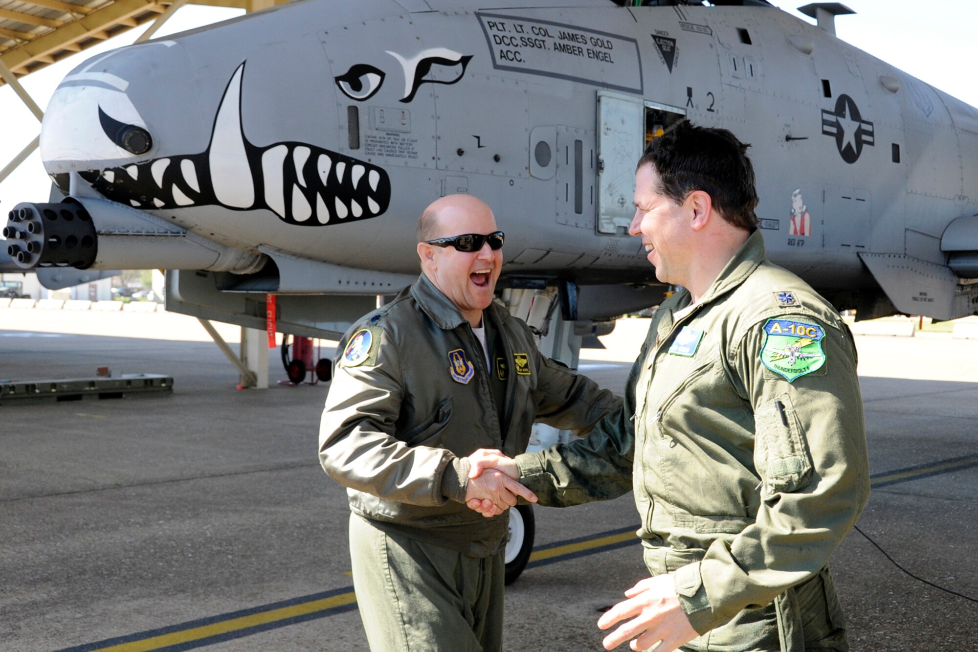 Lt. Col. James Gold is congratulated by Lt. Col. James Marks, commander, 917th Operations Support Flight, after returning from his last sortie in an A-10 Thunderbolt II at Barksdale Air Force Base, La., April 5, 2013. Schulz participated in a four-ship sortie for his last mission from Barksdale with three other pilots assigned to the 47th Fighter Squadron, who were also making their final flights. (U.S. Air Force photo by Master Sgt. Jeff Walston/Released)    