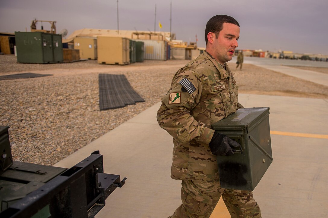Senior Airman Austin Stoker replenishes a .50-caliber machine gun after a training mission in Afghanistan, March 11, 2013. U.S. Air Force photo by Tech. Sgt. Dennis J. Henry Jr.)  
