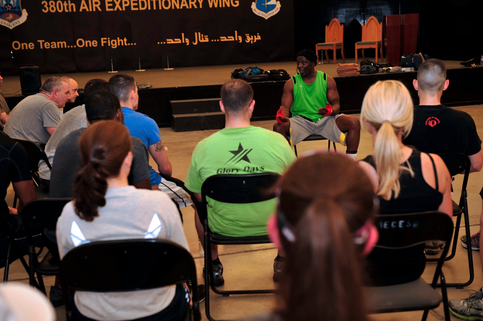 Tae Bo creator Billy Blanks speaks to members of the 380th Air Expeditionary Wing about health and fitness at an undisclosed location in Southwest Asia April 6, 2013. Blanks visited several bases in Southwest Asia with The American Gladiators during an Armed Forces Entertainment Fitness Tour. (U.S. Air Force photo by Tech. Sgt. Christina M. Styer/Released) 