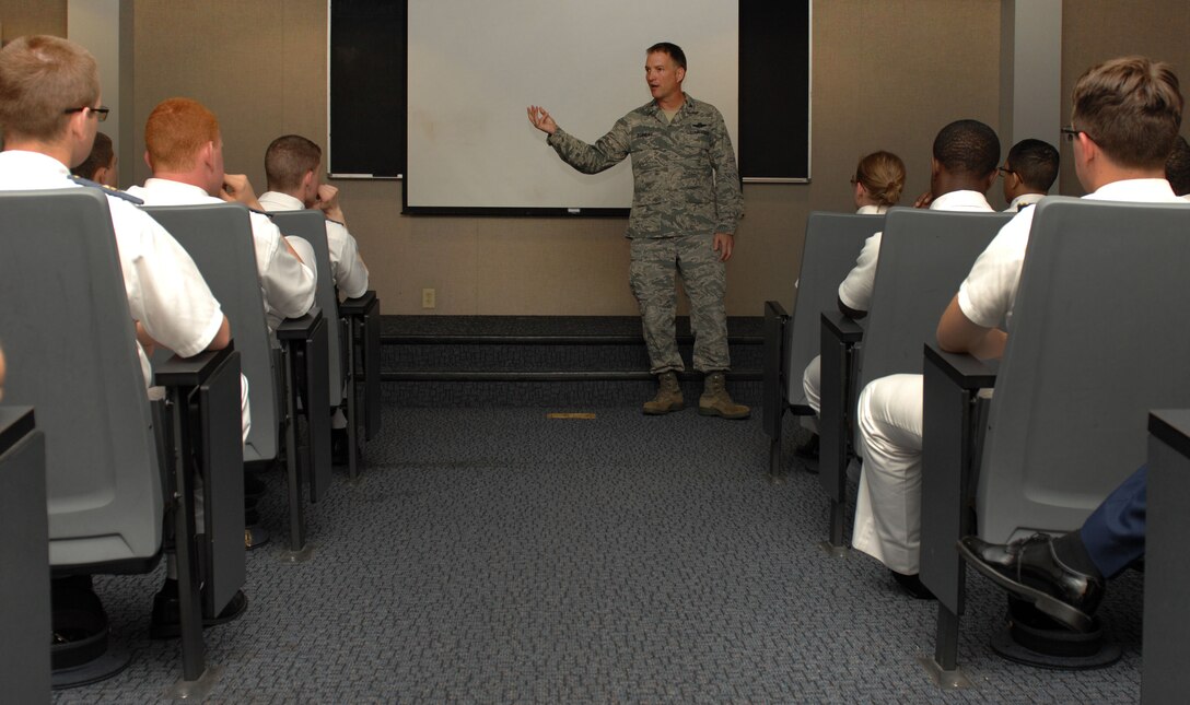 U.S. Air Force Col. Kevin Robbins, 1st Fighter Wing commander, speaks to more than 60 Virginia Military Institute cadets who visited Langley Air Force Base, Va., April 8, 2013. The cadets received an installation tour and mission briefings on various military assets and capabilities, including the F-22 Raptor. Robbins also talked to the "future military leaders" about preparing themselves for their careers in the military by establishing strong leadership principles and always putting mission first. (U.S. Air Force photo by Staff Sgt. Jeff Nevison/Released)