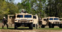 919th Security Forces Squadron members set up a perimeter around their HMMWVs during an extraction exercise at Duke Field, Fla., April 6. The Security Forces Airmen executed this training exercise with the trainees from the Development and Training Program. The DTP is an Air Force Reserve Command introductory program to help recruits prepare for military life prior to going to basic military training. The trainees were given a first-hand view of the procedures performed to recover American personnel from a downed aircraft in a hostile environment. (U.S. Air Force photo/Tech. Sgt. Cheryl L. Foster)