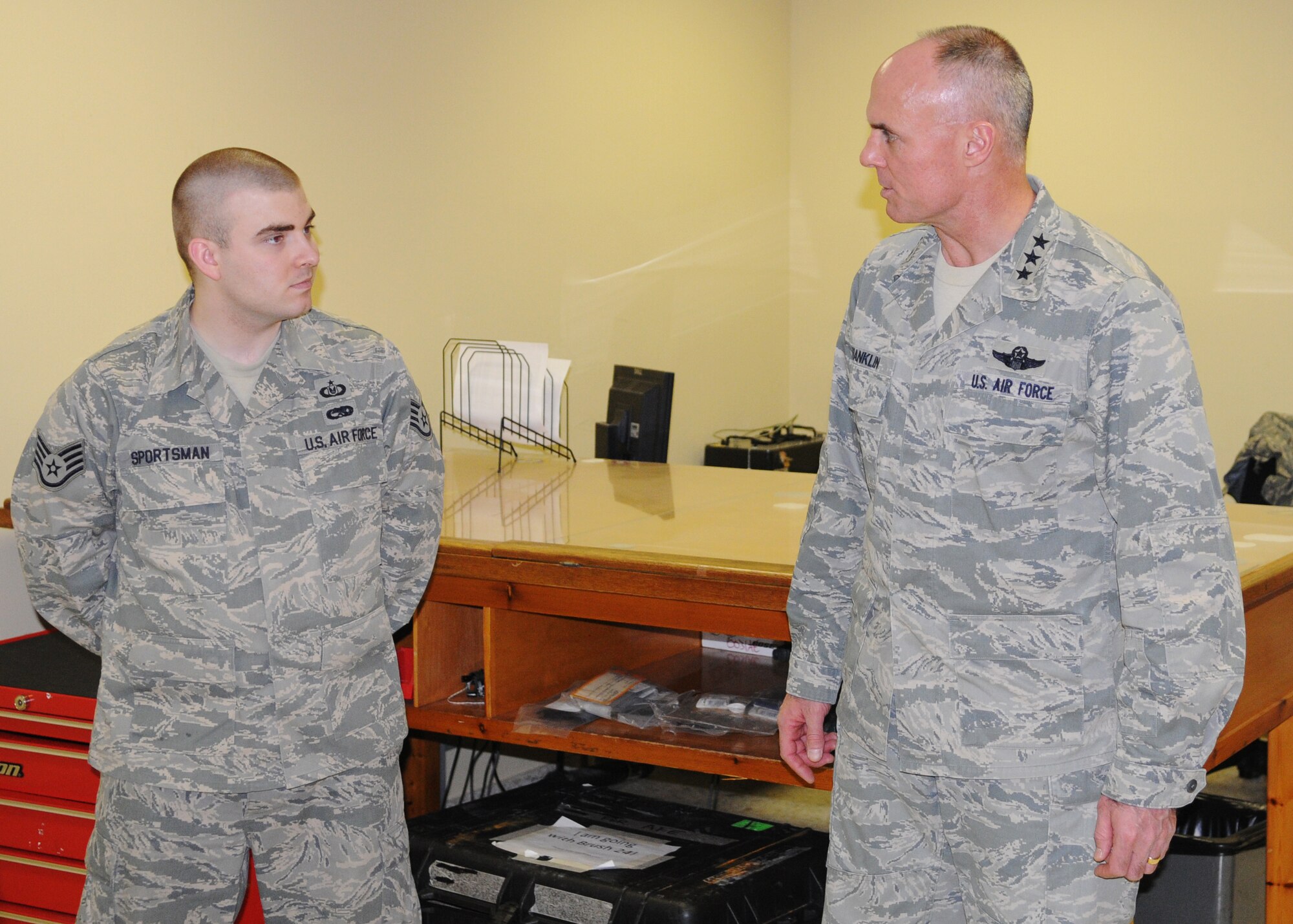 Lt. Gen. Craig A. Franklin, 3rd Air Force and 17th Expeditionary Air Force commander, and Staff Sgt. Anthony Sportsman, 351st Expeditionary Air Refueling Squadron, Aircrew Flight Equipment craftsman, discuss the mission of Sportsman’s work section April 8, 2013, at a location in Southwest Europe. Sportsman, originally from Springfield, Mo., talked with Franklin during his visit with the deployed Airmen who currently support French operations in Mali. (U.S. Air Force photo by 1st Lt. Christopher Mesnard/Released)