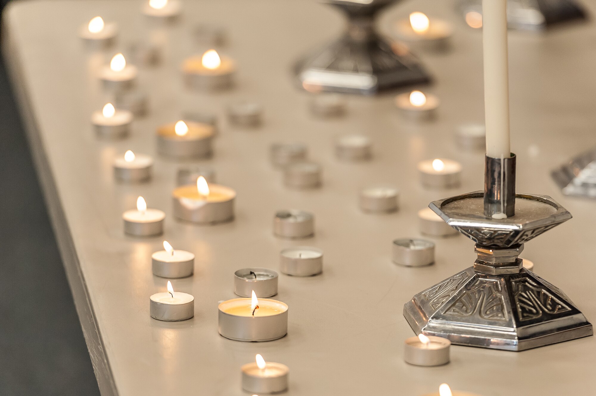 The 65th Air Base Wing held a formal ceremony commemorating the Holocaust, honoring the victims' memory and focusing on how Airmen stand against genocide and atrocities at Lajes Field, April 8.  The event included a name-reading and candle-light vigil held in conjunction with the National Holocaust Days of Remembrance. This year's national theme is "Never Again - Heeding the Warning Signs."  (Photo by Lucas Silva)     