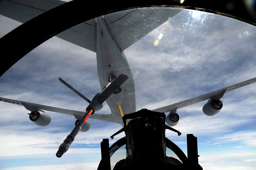 A U.S. Air Force KC-135 Stratotanker aerial refueling aircraft from the 909th Air Refueling Squadron refuels a 44th Fighter Squadron F-15 Eagle during a training mission over Okinawa, Japan, April 5, 2013. The 18th Wing regularly conducts flight training to ensure pilots remain proficient and mission ready for the common defense of Japan and the Asia-Pacific region. (U.S. Air Force photo/Senior Airman Maeson L. Elleman)