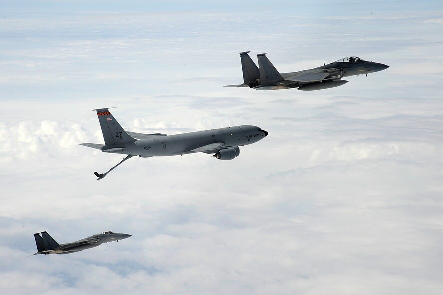 A U.S. Air Force KC-135 Stratotanker aerial refueling aircraft from the 909th Air Refueling Squadron flies alongside two 44th Fighter Squadron F-15 Eagles during a training mission over Okinawa, Japan, April 5, 2013. The 18th Wing regularly conducts flight training to ensure pilots remain proficient and mission ready for the common defense of Japan and the Asia-Pacific region. (U.S. Air Force photo/Senior Airman Maeson L. Elleman)