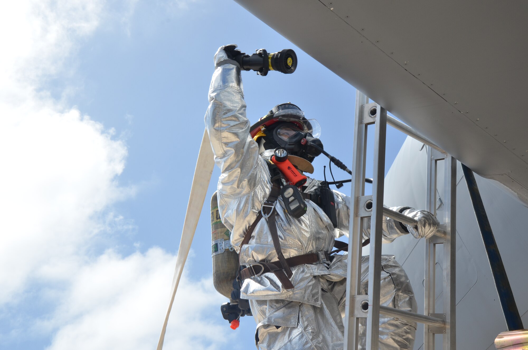 Tech. Sgt. Arnold Castro, 36th Civil Engineer Squadron Fire and Emergency Services station captain, participates in an aircraft fire training exercise on Andersen Air Force Base, Guam, April, 4, 2013. Castro was awarded Navy Fire and Emergency Services Military Firefighter of the Year for 2012. (U.S. Air Force photo by Staff Sgt. Veronica McMahon/Released)