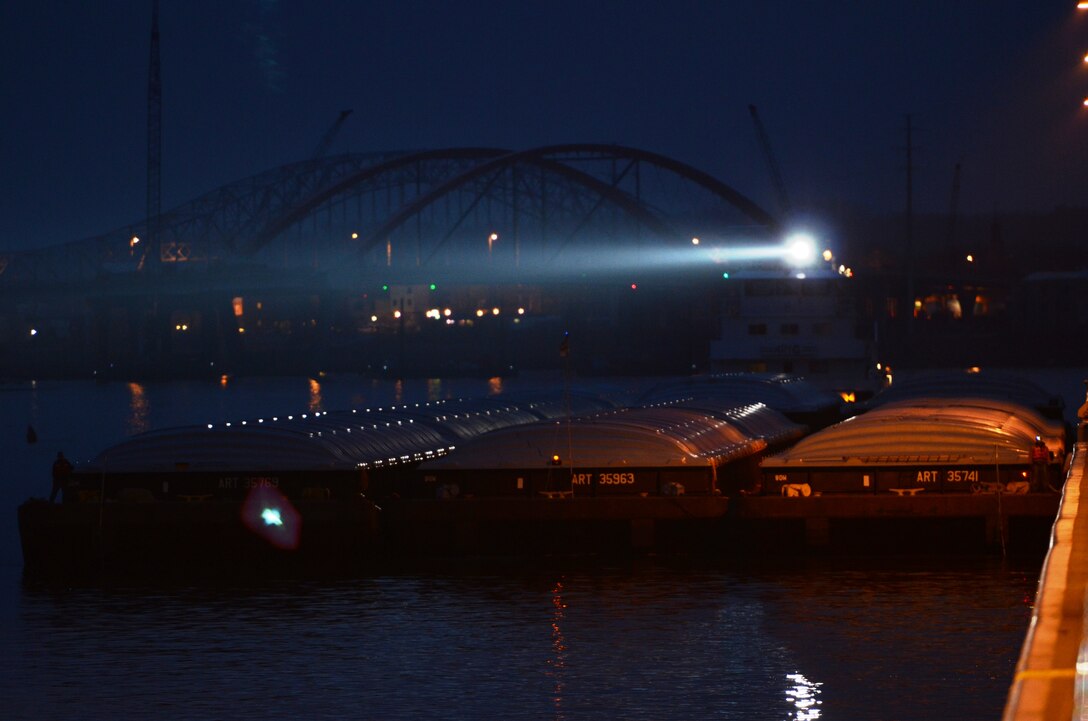 The Motor Vessel Roberta Tabor locks through Lock and Dam 2 in Hastings, Minn., April 8. The tow was the first to break through the ice at Lake Pepin on the Mississippi River and arrive in St. Paul, Minn. Traditionally, the first tow to break through the ice marks the unofficial start to the navigation season for the Corps of Engineers, St. Paul District.  (Photo by Patrick Moes)