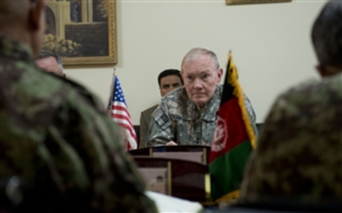 Chairman of the Joint Chiefs of Staff Gen. Martin E. Dempsey ¬listens to Chief of the General Staff of the Afghan Army Gen. Sher Mohammad Karimi as the two meet in Kabul, Afghanistan, on April 6, 2013.  Dempsey is meeting with deployed service members, coalition leaders and Afghan leaders to assess the progress of the transition to an Afghan-secured Afghanistan