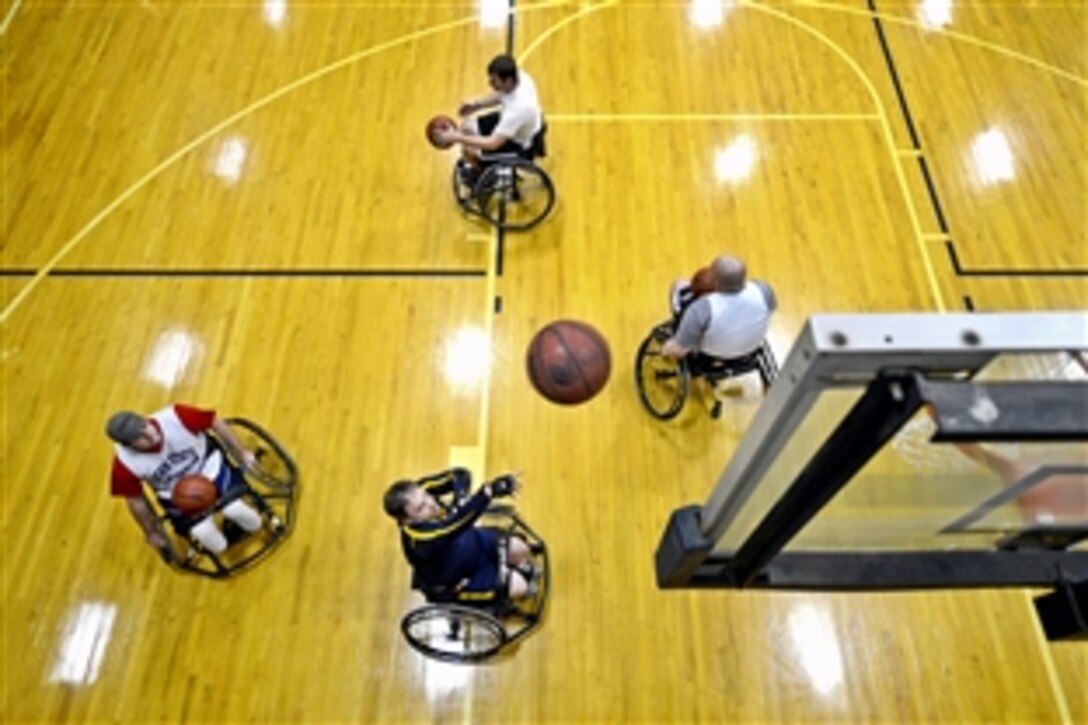 Retired Navy Lt. Rickey Bennett shoots during basketball practice for the upcoming Navy’s Wounded Warrior Games in State College Pa., April 4, 2013. 