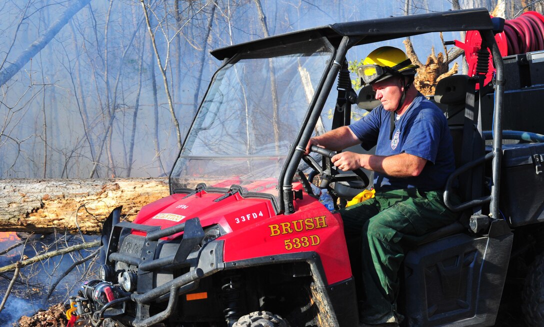 Quantico Fire Department and Emergency Rescue Services responded to a fire crawling through the woods in Training Area 11 on the west side of Marine Corps Base Quantico on April 9, 2013. The affected area was too large to extinguish outright so emergency responders limited the spread of the fire by bulldozing a "no burn" zone around it. After the zone had been crafted, firefighters fought fire with fire by "back-burning", a controlled burn designed to rob the fire of fuel so it can be managed safely.
