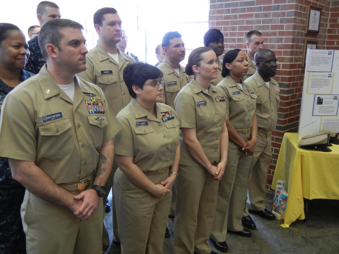 Naval Health Clinic Quantico’s chief petty officers, backed by their fellow sailors, stand at attention for the celebration of 120 years of the naval rank of chief petty officer on the clinic’s quarterdeck April 1, 2013. 