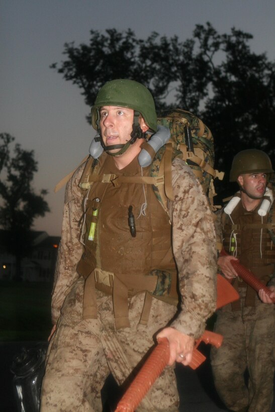 Sgt. Adam K. Smith completes a night hike during the culminating event of his Marine Corps Martial Arts Instructor course at Naval Air Station/Joint Reserve Base New Orleans, Sept. 14, 2011. Smith, the repairable issue point chief for Marine Forces Reserve G4 (logistics and services), was awarded the Navy and Marine Corps Commendation Medal after he was selected as the MARFORRES 2012 Marine of the Year (active component). Smith uses the training he received to train other Marines to “belt-up” in MCMAP. 