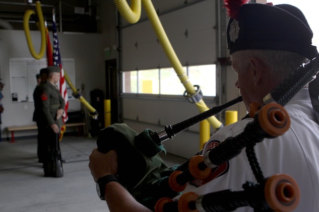 Dennis Rogers plays the bagpipe as Security and Emergency Battalion Color Guard “post the colors” during the dedication ceremony of Pendleton’s Fire Station 10 in honor of Sgt. Brian E. Dunlap here April 6. Rogers is a pipe major with the San Diego County Firefighters Pipes and Drums band. Dunlap was an advisor for the Iraqi Army and firefighter with the Camp Pendleton Fire Department and in 2005 and was killed by an improvised explosive device while conducting combat operations against enemy forces in Abu Fleiss, Iraq. 