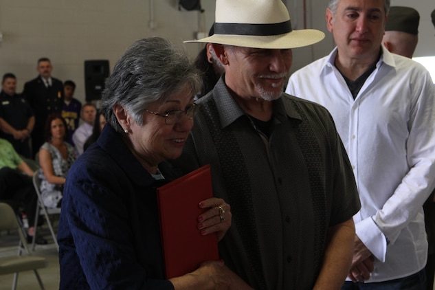 Dorothy Tellez, left, and cousin, Tom Tellez, attend a dedication ceremony of Pendleton’s Fire Station 10 to her son Sgt. Brian E. Dunlap here April 6. Dunlap was an advisor for the Iraqi Army and firefighter with the Camp Pendleton Fire Department and in 2005 and was killed by an improvised explosive device while conducting combat operations against enemy forces in Abu Fleiss, Iraq.