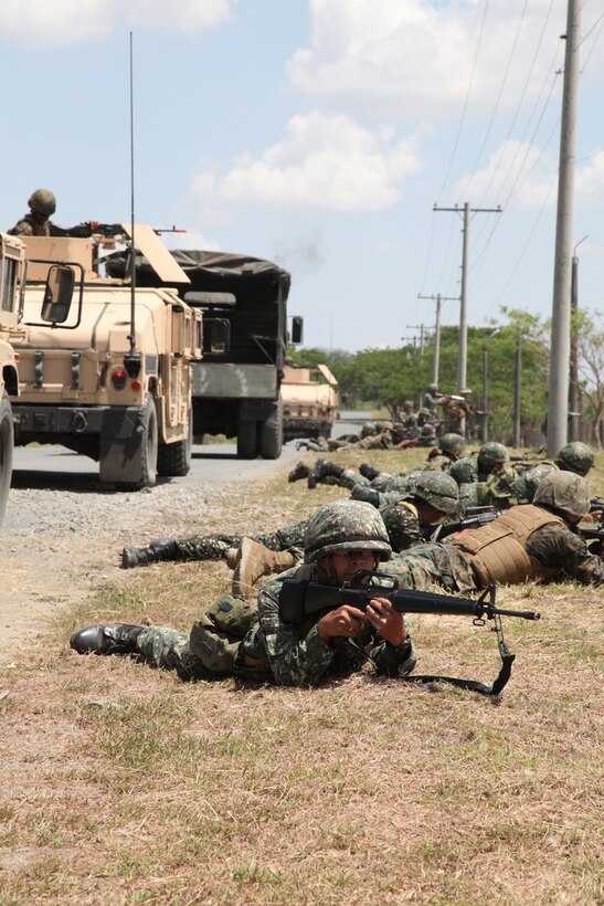 Armed Forces of the Philippines and U.S. Marines practice combat assault tactics during convoy operations training April 7 at Camp O'Donnell, Philippines, as part of exercise Balikatan 2013. "Learning the U.S. Marine Corps' convoy operations was a great opportunity," said Philippine Marine Capt. Recto C. Pumares, the officer in charge of 12th Marines Company, Motor Transportation Maintenance Battalion. "The U.S. has different trucks and techniques which made the training very interesting." BK13 is an annual bilateral exercise in its 29th iteration, which provides a venue for AFP and U.S. military forces to develop and continue to enhance interoperability across a wide range of military actions.
