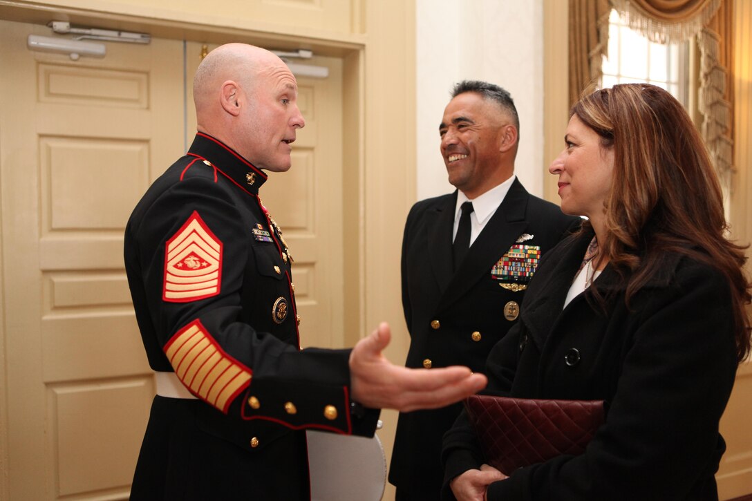 Sgt. Maj. Micheal P. Barrett, the 17th Sergeant Major of the Marine Corps, speaks with Master Chief Petty Officer Michael R. Ruiz, the Command Master Chief of U.S. Marine Corps Forces Command, and Mrs. Ruiz before the commissioning of the USS Arlington (LPD 24) in Norfolk, Va., on April 6, 2013. (U.S. Marine Corps photo by Sgt. Marionne T. Mangrum)