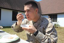 Lance Cpl. Matthew Mahoney eats a bowl of chili to support Headquarters and Headquarters Squadron’s chili cook-off to raise money for the Marine Corps Birthday Ball, March 28. The event raised more than $450 toward the Marine Corps Birthday Ball. (USMC Photo by LCpl Lance Cpl. Manuel A. Estrada)