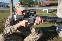 Marines snap in during grass week to practice aiming, breathing and pulling the trigger. During grass week, Marines utilize marksmanship instructors to go over the fundamentals in Marine Corps marksmanship. 
