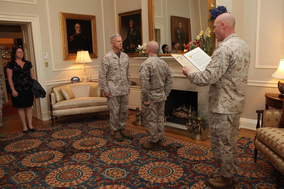 Staff Sgt. Travis L. Cameron is promoted by Gen. James F. Amos, the 35th Commandant of the Marine Corps, and Sgt. Maj. Micheal P. Barrett, the 17th Sergeant Major of the Marine Corps, at the Home of the Commandants, Marine Barracks Washington, D.C., on April 8, 2013. (U.S. Marine Corps photo by Sgt. Marionne T. Mangrum)
