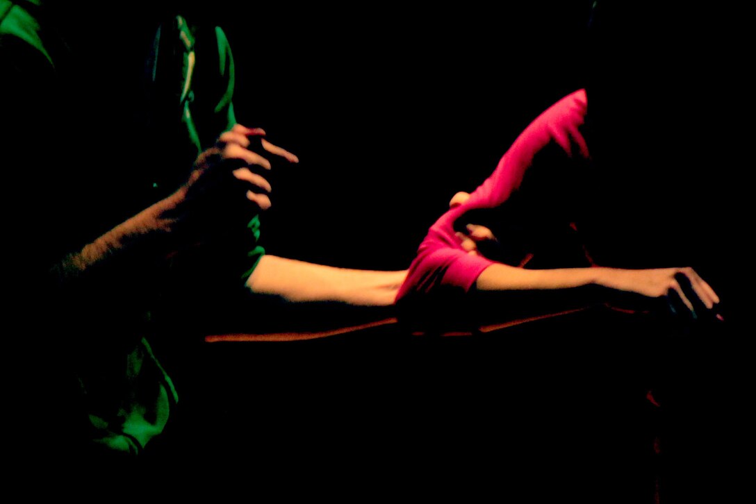 Rich Bronson and Christie Martin, cast members of “No Zebras and More,” act out a scene of an abusive relationship during a performance at the Combat Center’s Sunset Cinema March 26, 2013.