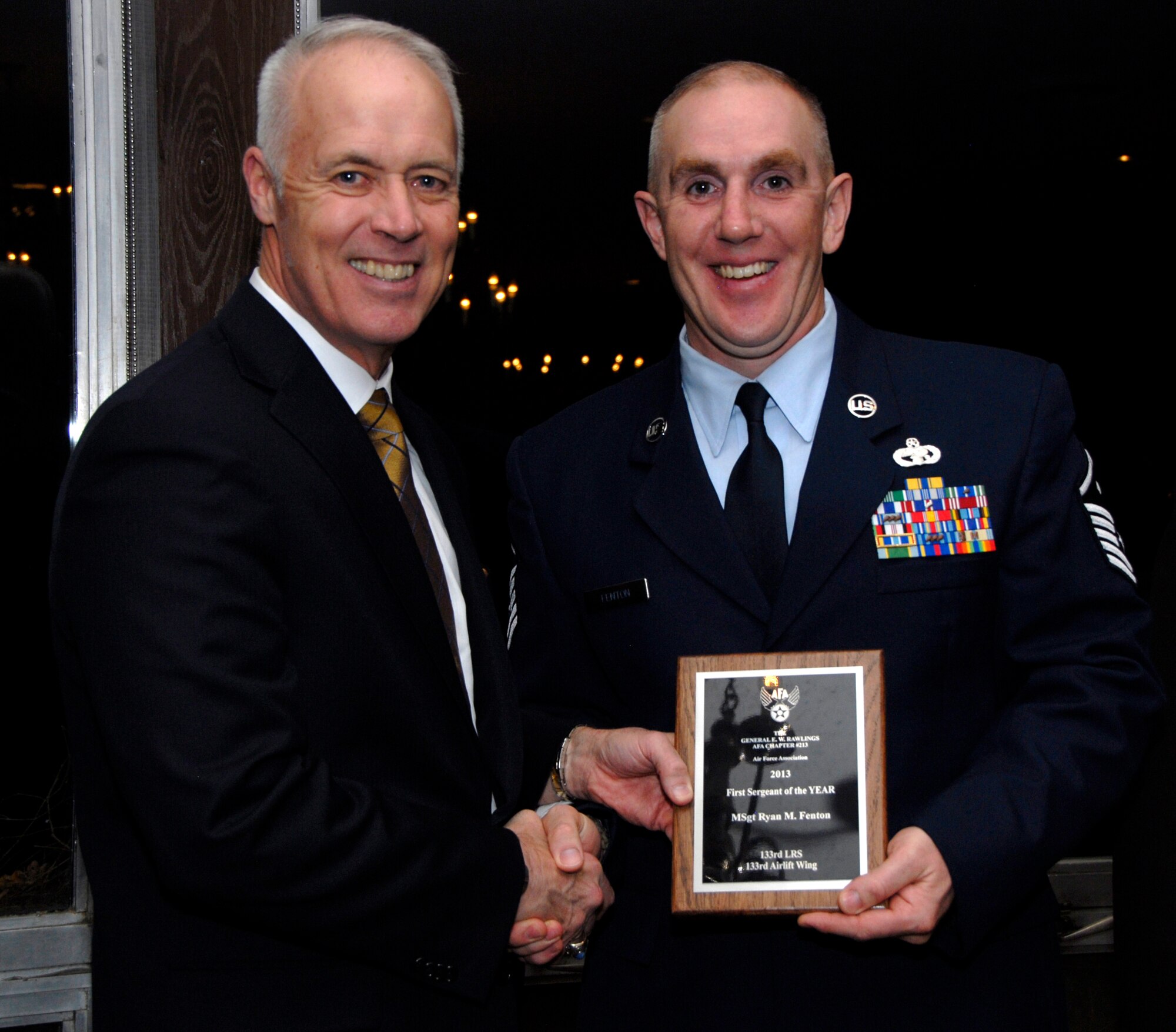 Master Sgt. Ryan Fenton, 133rd Logistics Readiness Squadron, receives an award from Retired U.S. Air Force Lt. Gen. Richard Newton, Executive Vice President of the Air Force Association in St. Paul, Minn., Apr. 5, 2013. Fenton is being honored for being the 133rd Airlift Wing’s First Sergeant of the Year during the Air Force Association’s Annual Awards Dinner.
(U.S. Air Force photo by Airman 1st Class Kari Giles /Released)