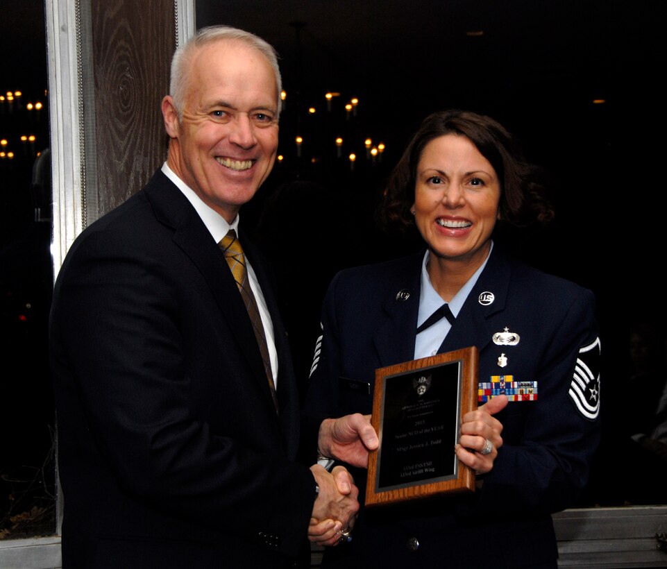 Master Sgt. Jessica Todd, 133rd Force Support Squadron, receives an award from Retired U.S. Air Force Lt. Gen. Richard Newton, Executive Vice President of the Air Force Association in St. Paul, Minn., Apr. 5, 2013. Todd is being honored for being the 133rd Airlift Wing Senior NCO of the Year during the Air Force Association’s Annual Awards Dinner.
(U.S. Air Force photo by Airman 1st Class Kari Giles /Released)
