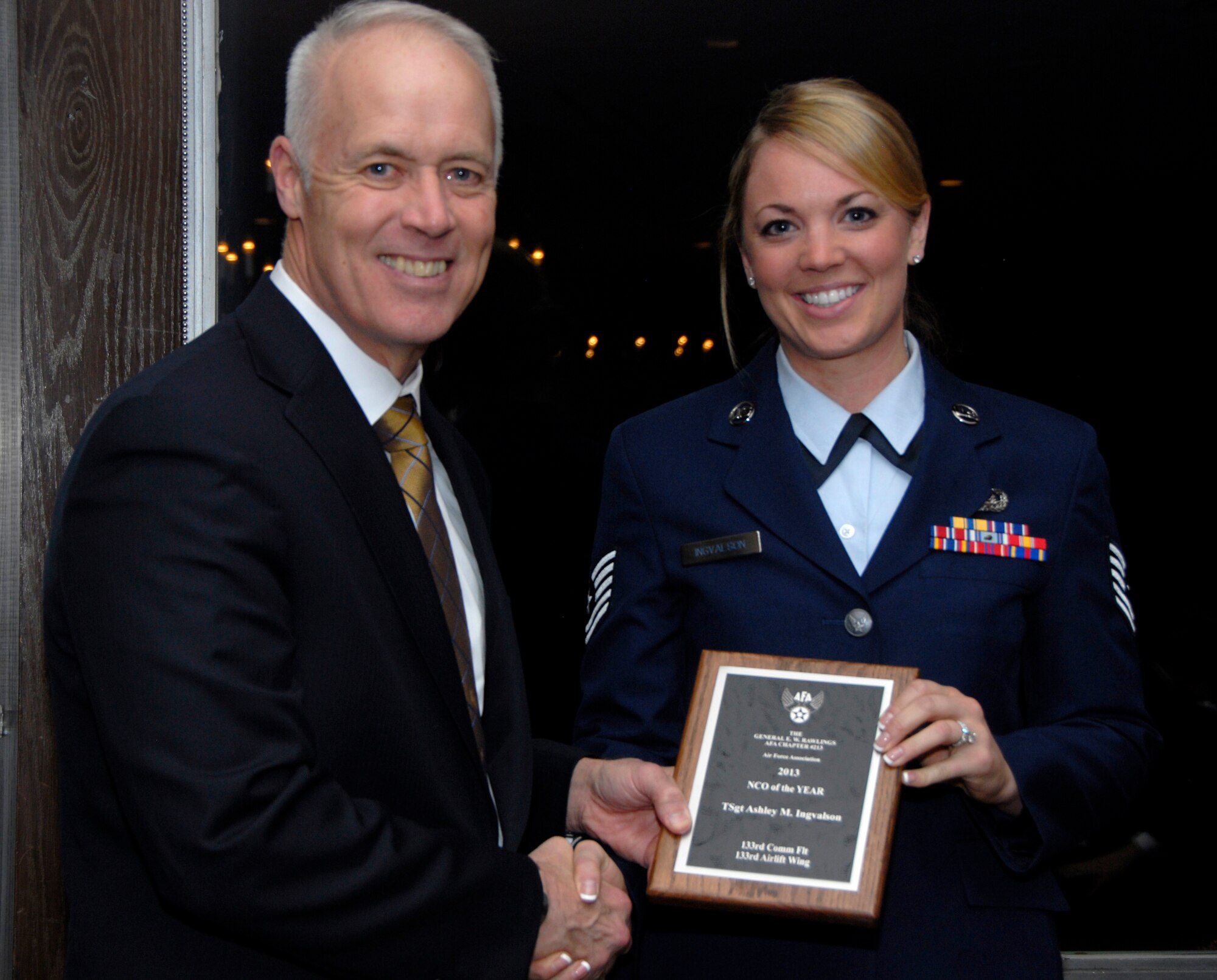 Tech. Sgt. Ashley Ingvalson, 133rd Communications Flight, receives an award from Retired U.S. Air Force Lt. Gen. Richard Newton, Executive Vice President of the Air Force Association in St. Paul, Minn., Apr. 5, 2013. Ingvalson is being honored for being the 133rd Airlift Wing NCO of the Year award during the Air Force Association’s Annual Awards Dinner.
(U.S. Air Force photo by Airman 1st Class Kari Giles /Released)