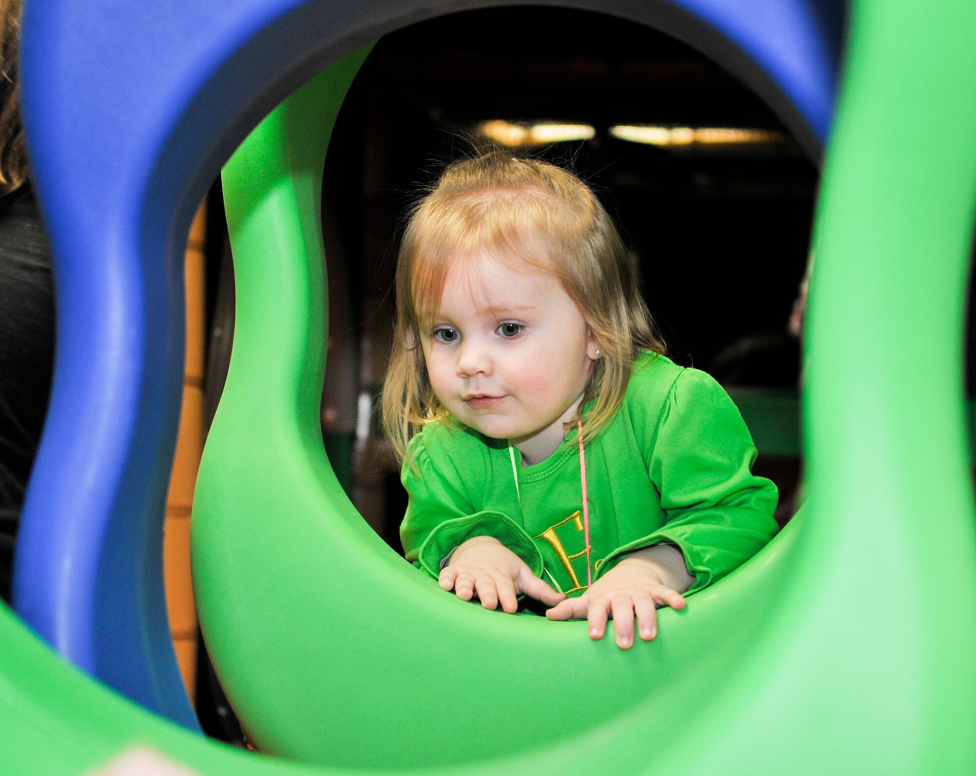 Emmersyn Stringer, daughter of U.S. Air Force Senior Airman Kyle Stringer, 354th Medical Support Squadron public health technician, plays in the indoor jungle gym during Eielson City Center’s opening March 29, 2013, Eielson Air Force Base, Alaska. The ECC offers parents the option of working out while their children play safely in various areas. (U.S. Air Force photo/ Senior Airman Racheal E. Watson/Released)