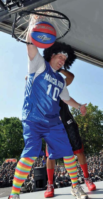 The 452d Air Mobility Wing leadership used an unconventional commander's call to recognize teams and individuals on their performance during the Operational Readiness and Nuclear Operational Readiness Inspections. Col. Samuel Mahaney, commander; Col. James Finney, (pictured) vice commander; and Chief Master Sgt. Ericka Kelly, command chief, beat the unofficial Air Mobility Command Inspector General basketball team to represent the wing's recent, successful completion of both inspections. (U.S. Air Force photos by Master Sgt. Linda Welz)