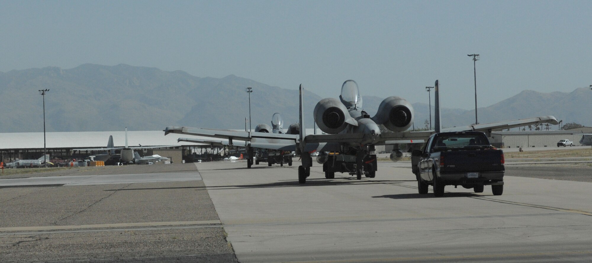 Members of the 355th Fighter Wing A-10 Divestiture Team retire two A-10C Thunderbolt II aircraft to the 309th Aerospace Maintenance and Regeneration Group at Davis-Monthan Air Force Base, Ariz., April 8, 2013. The aircraft have been flying since the late 1970’s and will be used for parts on aircraft still flying. (U.S. Air Force photo by Airman 1st Class Betty R. Chevalier/released)