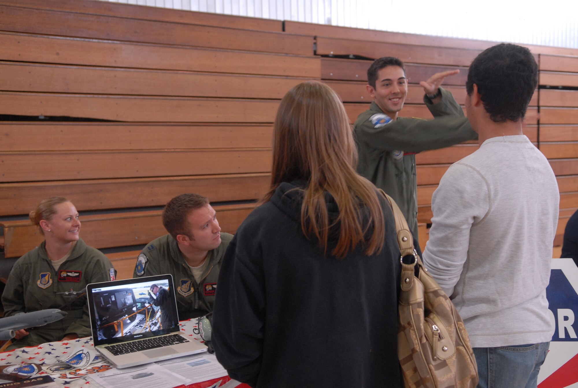 U.S. Air Force 1st Lt. Alan Herbol and Capt. Andrew Lawrence, 909th Air Refueling Squadron  pilots, explain the necessity of refueling in the Pacific theater during the Kadena High School Career Day on Kadena Air Base, Japan, April 4, 2013. Hosted by the Air Force Cadet Officer Mentor Action Program, the purpose of the event was to offer a glimpse of Airmen's daily duties to possible recruits. (U.S. Air Force photo by Staff Sgt. Lauren Snyder/Released)