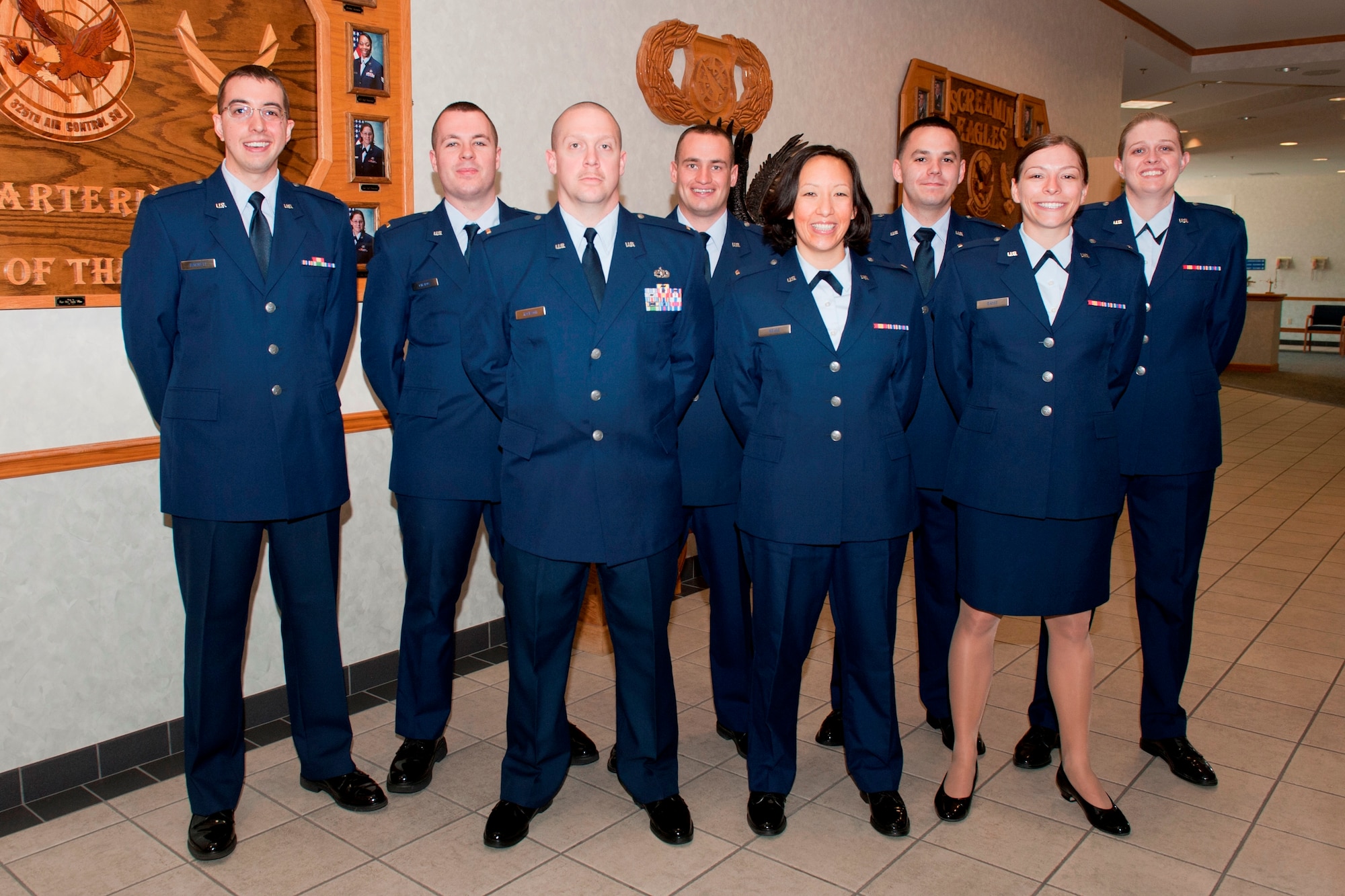 Graduate members of Air Battle Management training class 13009 poses for a celebratory photo after graduating April 10, 2013. (U.S. Air Force photo by Lisa Norman)