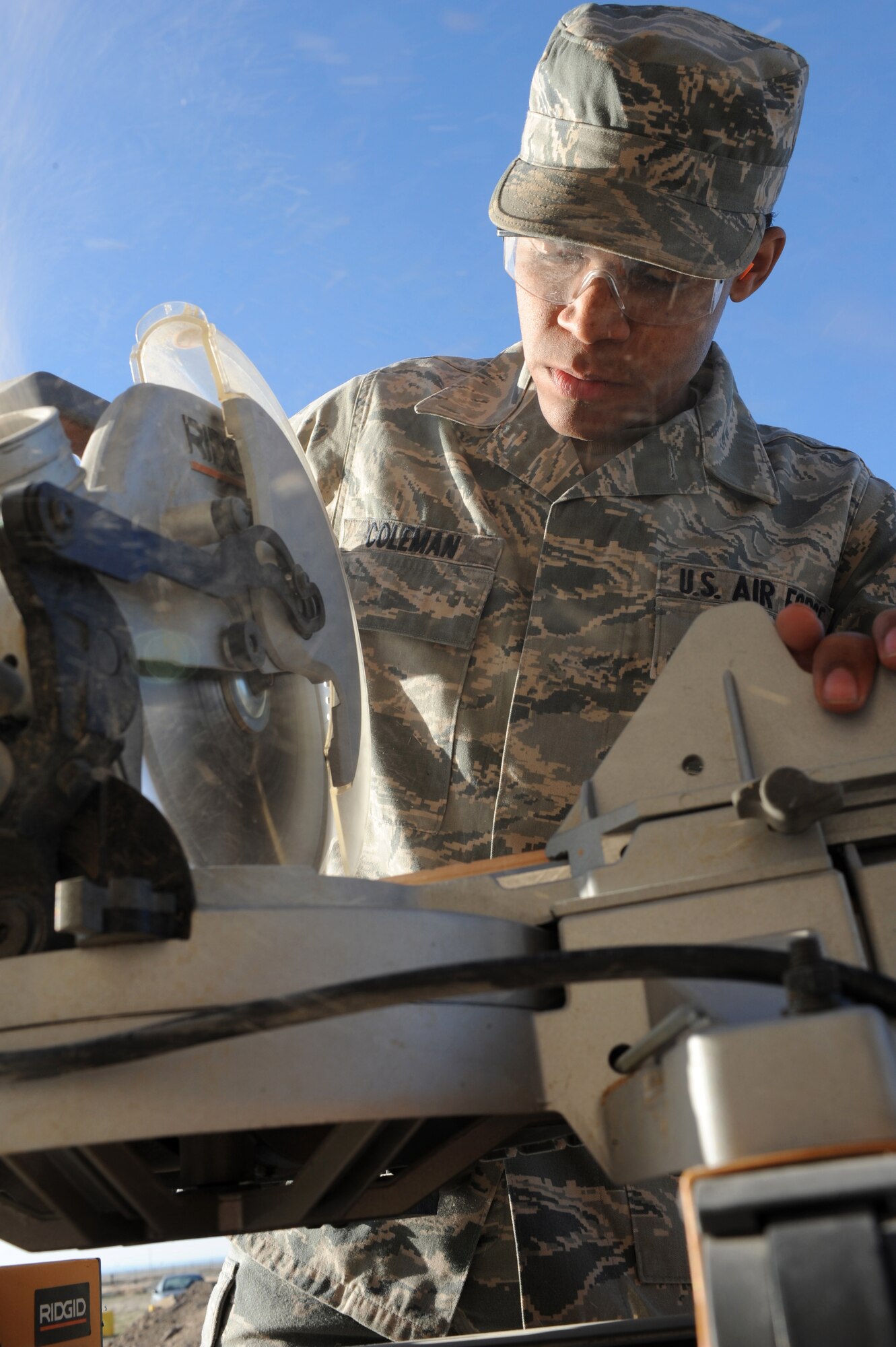 U.S. Air Force Airman 1st Class Nathan Coleman, 366th Civil Engineer Squadron structures journeyman, cuts building materials at a simulated deployed location, Mountain Home Air Force Base, Idaho, April 1, 2013. The design and construction of the revetment is only hindered by the imagination of the Airmen completing the task.   (U.S. Air Force photo/Staff Sgt. Roy Lynch) (Released)