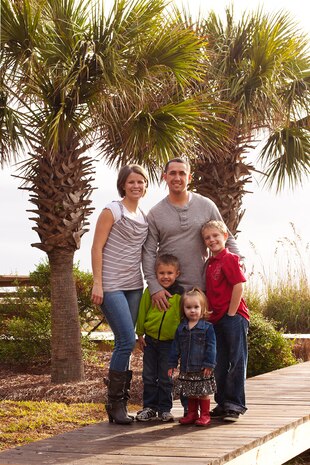 Staff Sgt. William Benson, 628th Security Forces Squadron, and his wife, Abbey, along with their children enjoy a vacation courtesy of Operation R&R at Isle of Palms, S.C. Benson returned from a deployment in November 2011, and used the vacation to aid in the rebuilding of a family bond. (Courtesy photo)