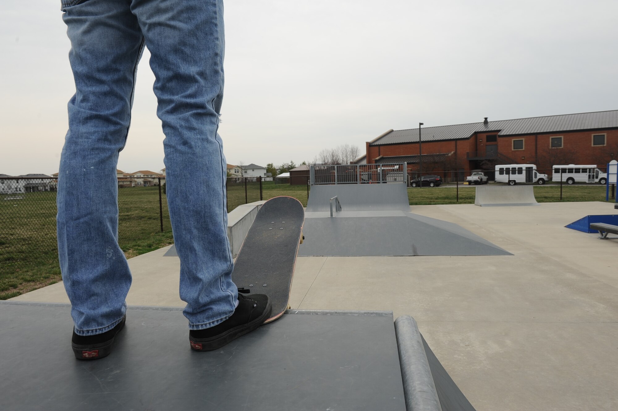 A skateboarder prepares to drop-in on the half-pipe in the newly reopened skate park April 8, 2013. The $202,000 park was closed for a year because of vandalism, lack of upkeep and lack of use. (U.S. Air Force photo/Airman 1st Class Josh Eikren)