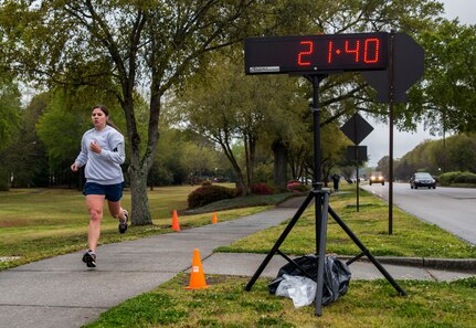 Airman 1st Class Michelle Di Ciolli, 1st Combat Camera Squadron broadcaster, crosses the finish line during the 5k Commander's Challenge Run April 5, 2013, at Joint Base Charleston – Air Base, S.C. Di Ciolli finished as the top female participant with a time of 21:40. (U.S. Air Force photo/ Senior Airman George Goslin)