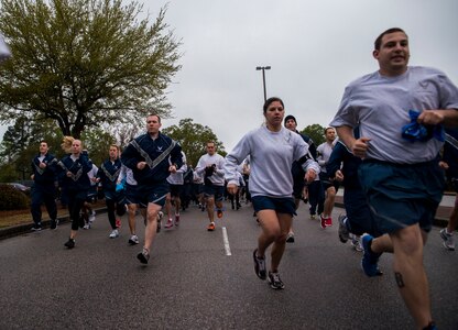 Participants start the 5k Commander's Challenge Run April 5, 2013, at Joint Base Charleston – Air Base, S.C. The 5k was held to kick off Sexual Assault Awareness Month. (U.S. Air Force photo/ Senior Airman George Goslin)