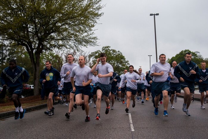 Participants start the 5k Commander's Challenge Run April 5, 2013, at Joint Base Charleston – Air Base, S.C.  The 5k was held to kick off Sexual Assault Awareness Month. (U.S. Air Force photo/ Senior Airman George Goslin)