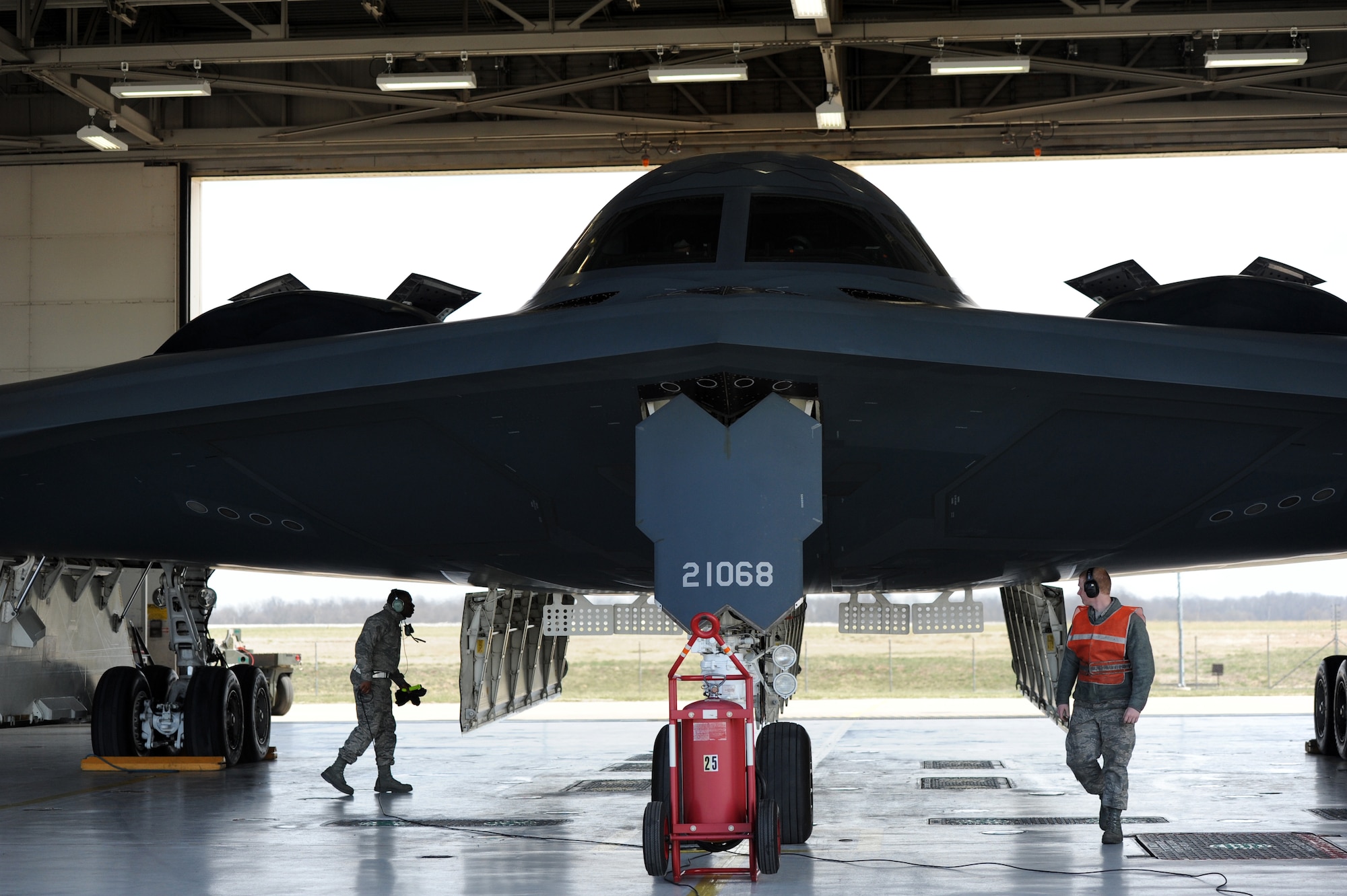 Airman 1st Class Steven McCray, 13th Aircraft Maintenance Unit B-2 Spirit crew chief, and Airman 1st Class James Fulton, 13th Aircraft Maintenance Unit B-2 crew chief, perform pre-flight checks at Whiteman Air Force Base, April 5, 2013.  Because of their mission and constant operations tempo, B-2 crew chiefs must remain alert and aware of every maintenance issue involving their assigned aircraft. (U.S. Air Force photo by Staff Sgt. Nick Wilson/Released)







