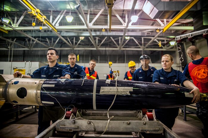 Mine Assembly Team One shifts a training MK63 QUICKSTRIKE mine to its next assembly station during a bi-annual Mine Readiness Certification April 1, 2013, at Joint Base Charleston – Weapons Station, S.C. (U.S. Air Force photo / Senior Airman Dennis Sloan)